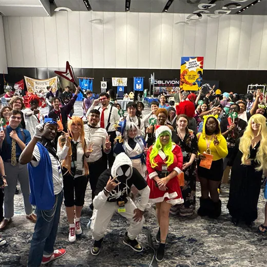 Costumed crowd filling a convention hall