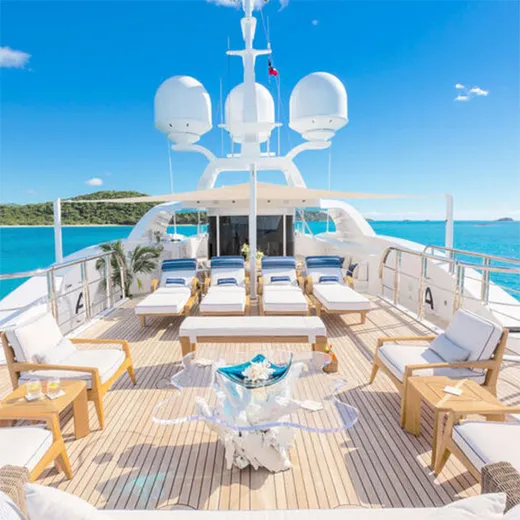 Superyacht sundeck over turquoise water